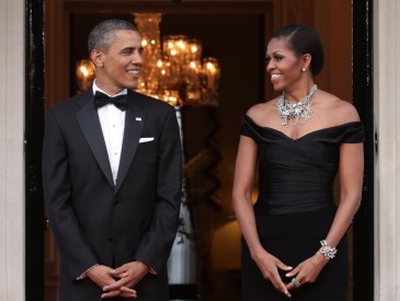 LONDON, ENGLAND - MAY 25:  U.S. President Barack Obama and First Lady Michelle Obama arrive at Winfield House, the residence of the Ambassador of the United States of America, in Regent's Park, on May 25, 2011 in London, England. The 44th President of the United States, Barack Obama, and First Lady Michelle are in the UK for a two day State Visit at the invitation of HM Queen Elizabeth II. Last night they attended a state banquet at Buckingham Palace and today’s events include talks at Downing Street and the President will address both houses of Parliament at Westminster Hall.  (Photo by Yui Mok - WPA Pool/Getty Images)