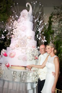 Princess Charlene of Monaco and Prince Albert II of Monaco cut their cake during the dinner at the Opera after their religious wedding on July 2, 2011 in Monaco.   AFP PHOTO / POOL PALAIS PRINCIER / Eric MATHON (Photo by ERIC MATHON / PALAIS PRINCIER / AFP) (Photo by ERIC MATHON/PALAIS PRINCIER/AFP via Getty Images)