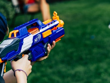 kid holding water gun