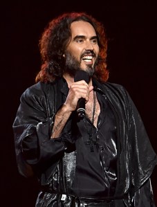 LOS ANGELES, CALIFORNIA - JANUARY 24: Russell Brand speaks onstage during MusiCares Person of the Year honoring Aerosmith at West Hall at Los Angeles Convention Center on January 24, 2020 in Los Angeles, California. (Photo by Lester Cohen/Getty Images for The Recording Academy )