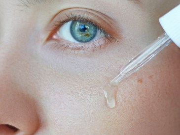 woman using facial serum, like e.l.f. Skin Vitamin C + E + Ferulic Serum, a $16 Skinceuticals Lookalike