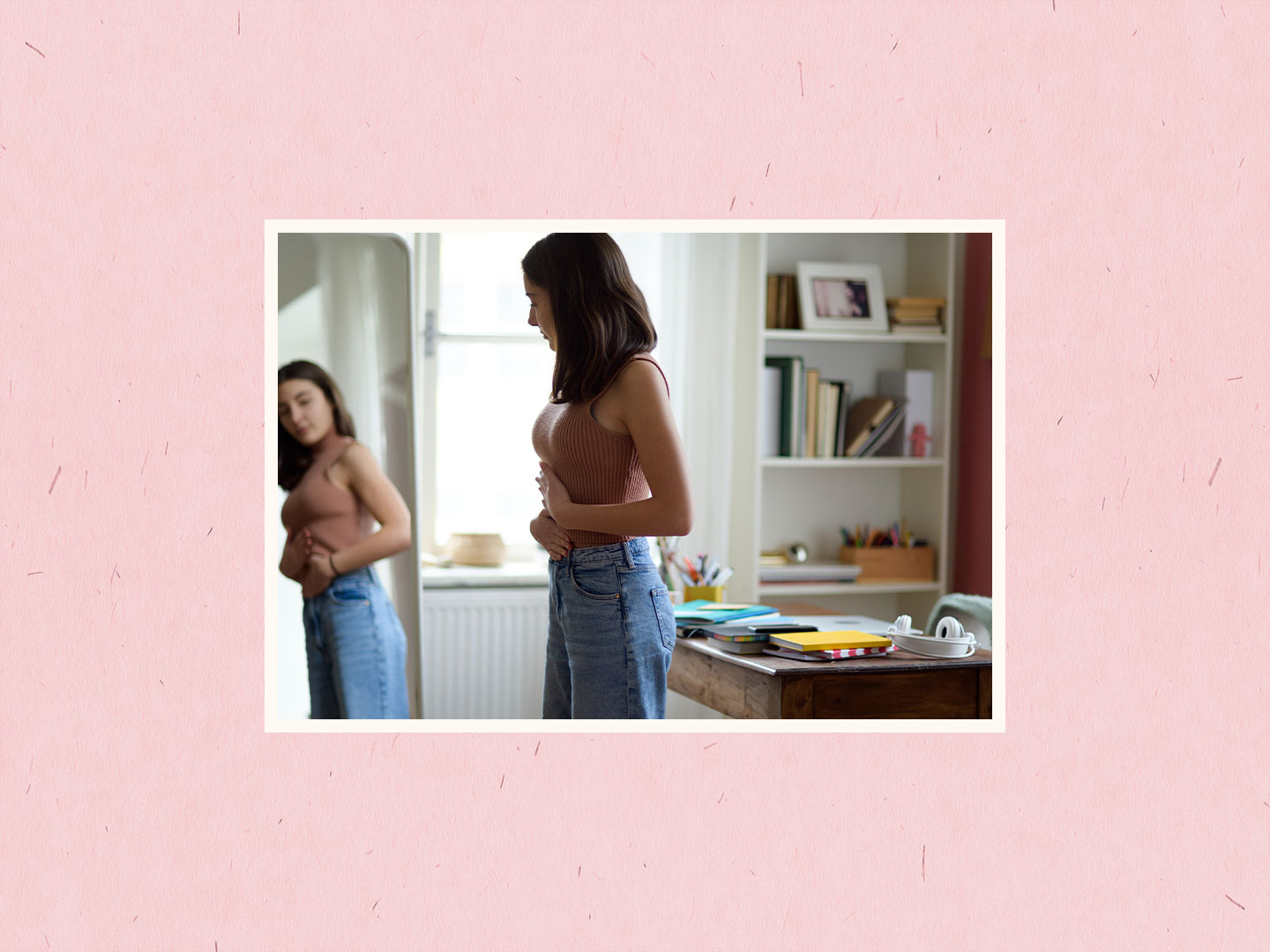 teen looking in mirror