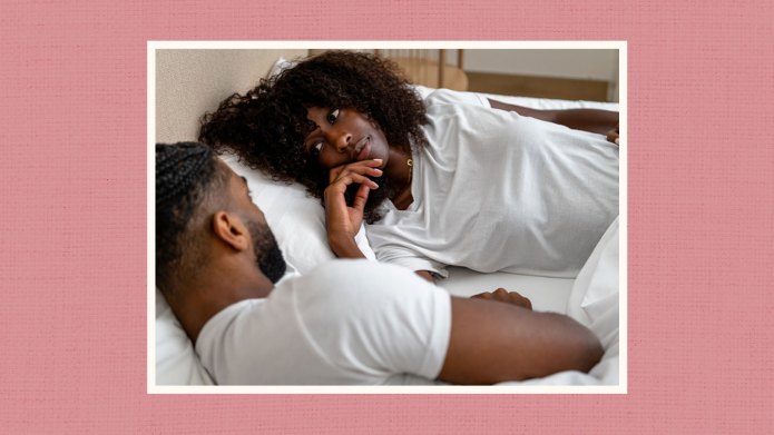 Couple talking in bed