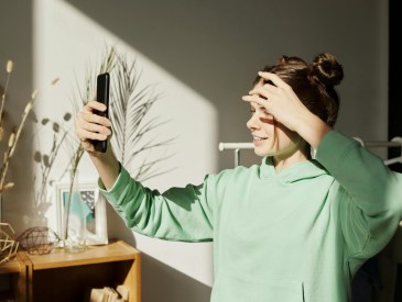 teen girl looking at phone